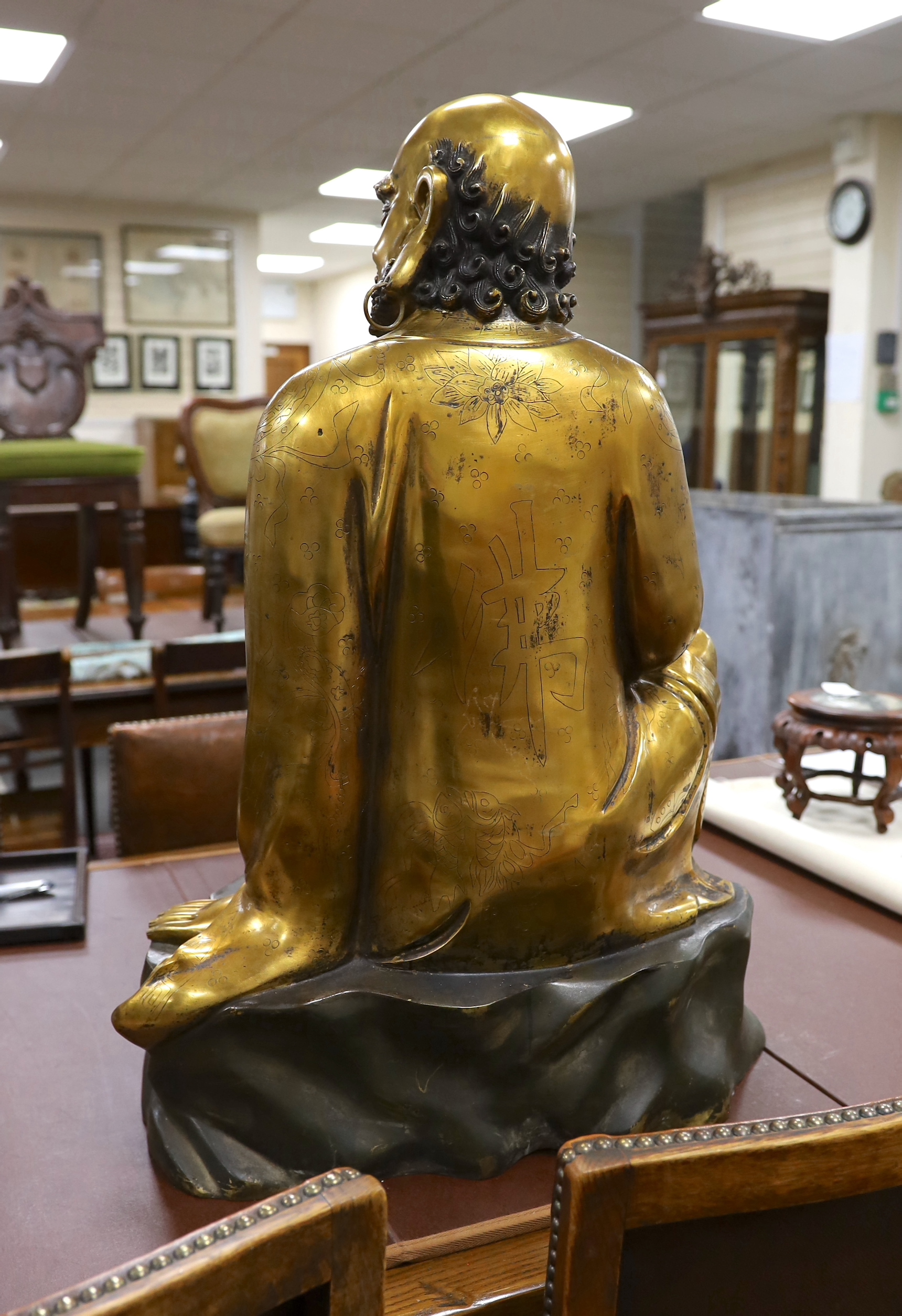 A large Chinese bronze seated figure of a Luohan, 20th century, height 72cm.
